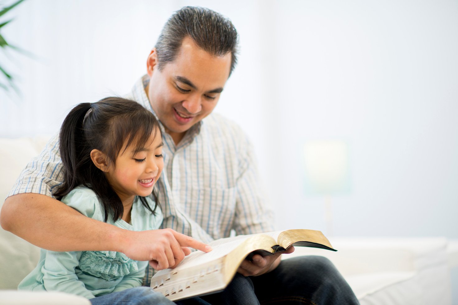 Father and Daughter Reading the Bible